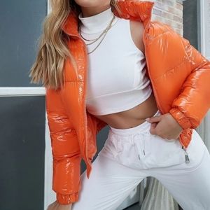 Orange women's wet look  cropped puffer coat size medium new with out ta…